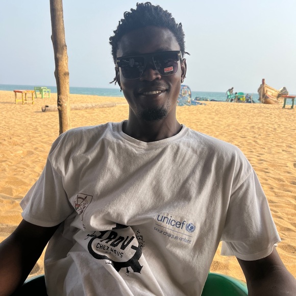 These shirts are made by Didier Adjewodo of Togo, West Africa. - Picture 5 of 6